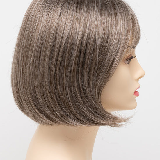 profile side of a short Kinner Beauty Wigs wig on woman head 