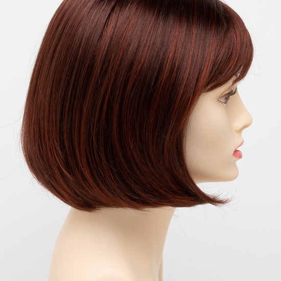 profile side of a short Kinner Beauty Wigs wig on woman head 