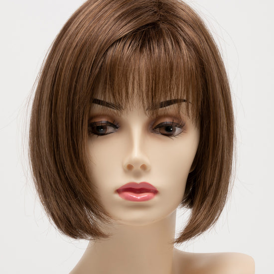 front side of a short Kinner Beauty Wigs wig for woman on mannequin head 