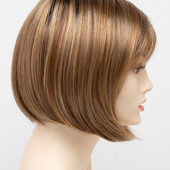 profile side of a short Kinner Beauty Wigs wig on woman head 