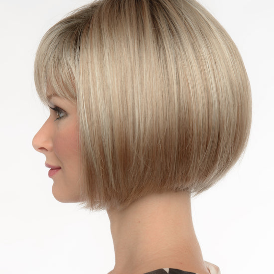 profile side of a short Kinner Beauty Wigs wig on woman head 