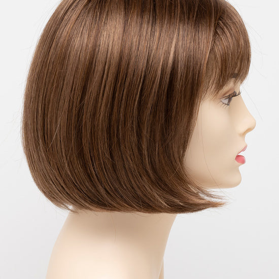 profile side of a short Kinner Beauty Wigs wig on woman head 