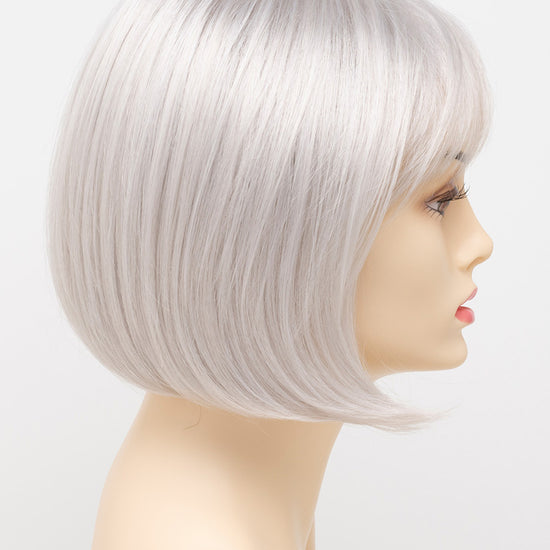 profile side of a short Kinner Beauty Wigs wig on woman head 