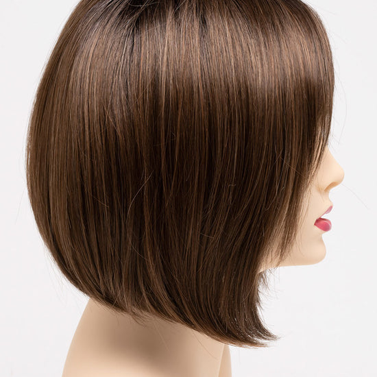 profile side of a short Kinner Beauty Wigs wig on woman head 