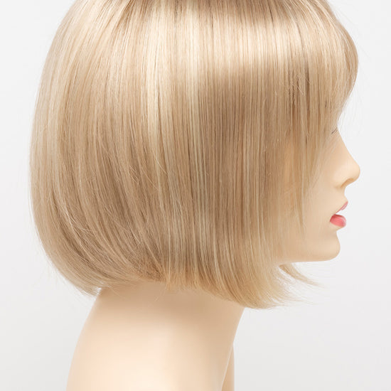 profile side of a short Kinner Beauty Wigs wig on woman head 