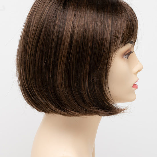 profile side of a short Kinner Beauty Wigs wig on woman head 