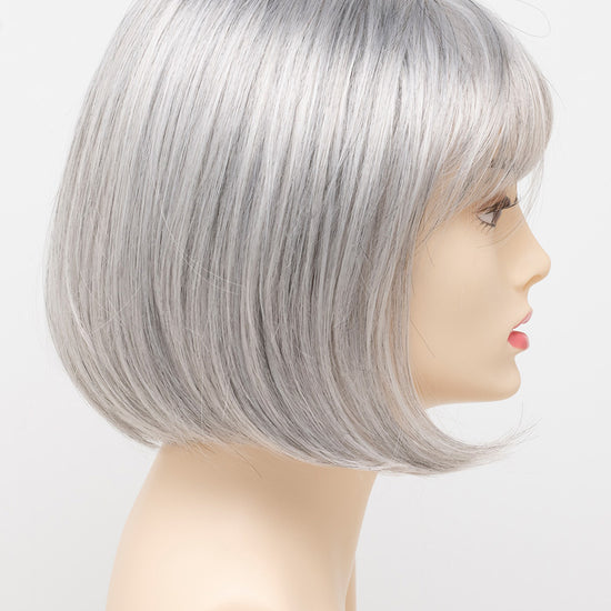 profile side of a short Kinner Beauty Wigs wig on woman head 