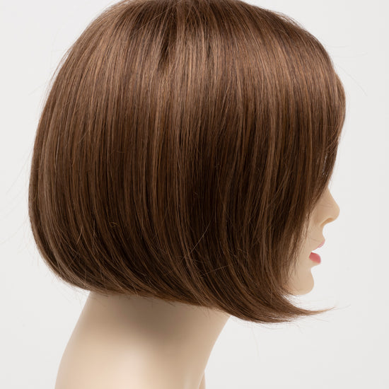 profile side of a short Kinner Beauty Wigs wig on woman head 