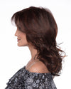 profile side of a long Kinner Beauty Wigs wig on woman head 