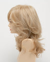 profile side of a long Kinner Beauty Wigs wig for woman on mannequin head 