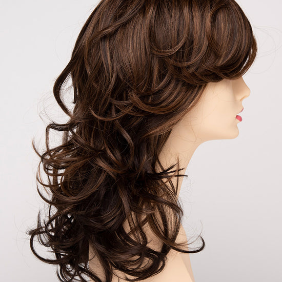 profile side of a long Kinner Beauty Wigs wig for woman on mannequin head 