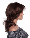 profile side of a long Kinner Beauty Wigs wig on woman head 