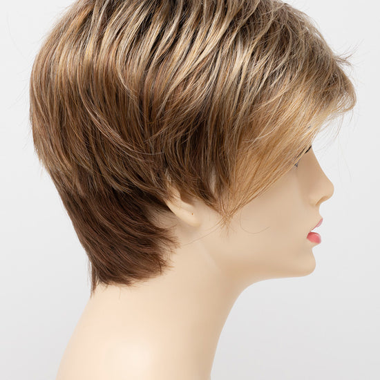 profile side of a short Kinner Beauty Wigs wig on woman head 