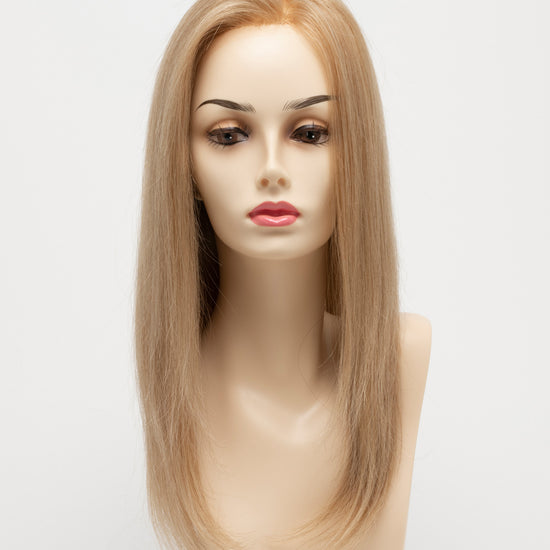 front side of a long Kinner Beauty Wigs wig for woman on mannequin head 