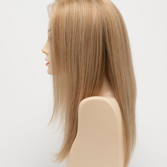 profile side of a long Kinner Beauty Wigs wig for woman on mannequin head 