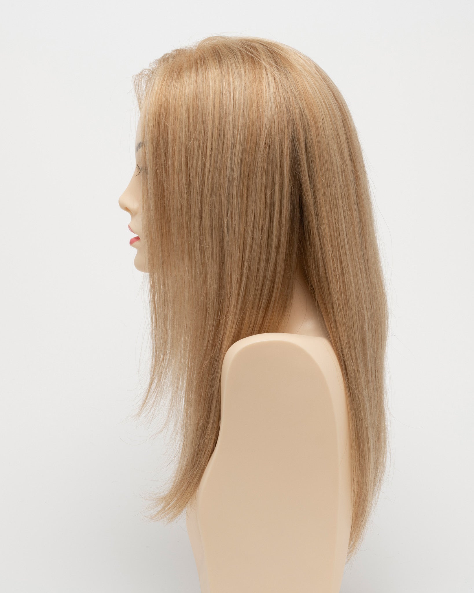 profile side of a long Kinner Beauty Wigs wig for woman on mannequin head 