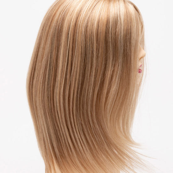 profile side of a long Kinner Beauty Wigs wig for woman on mannequin head 