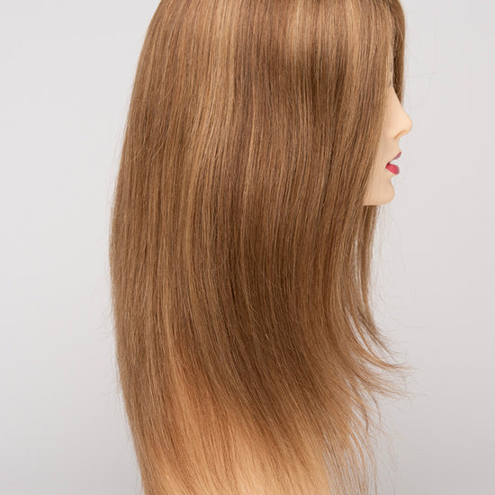 profile side of a long Kinner Beauty Wigs wig for woman on mannequin head 