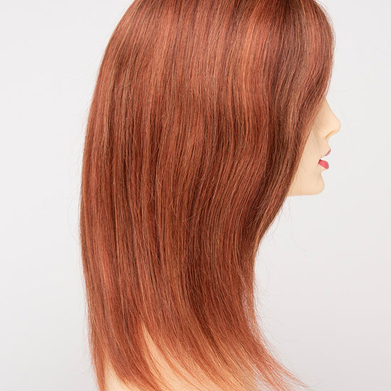 profile side of a long Kinner Beauty Wigs wig for woman on mannequin head 