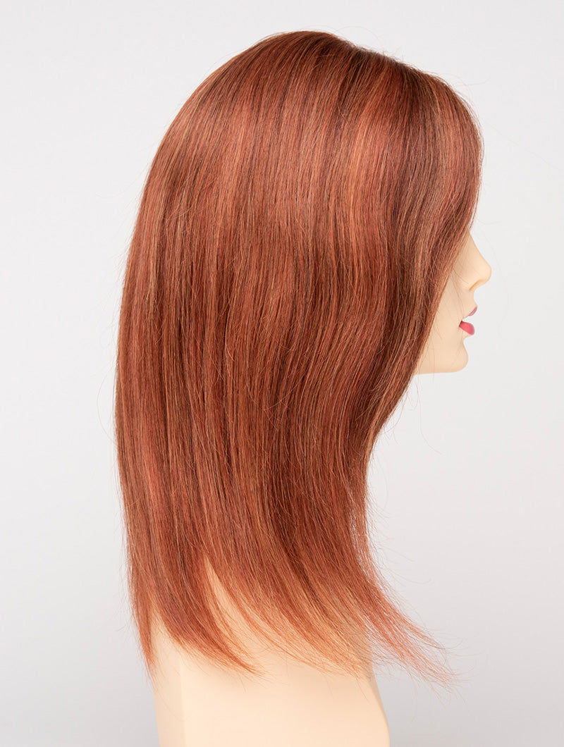 profile side of a long Kinner Beauty Wigs wig for woman on mannequin head 