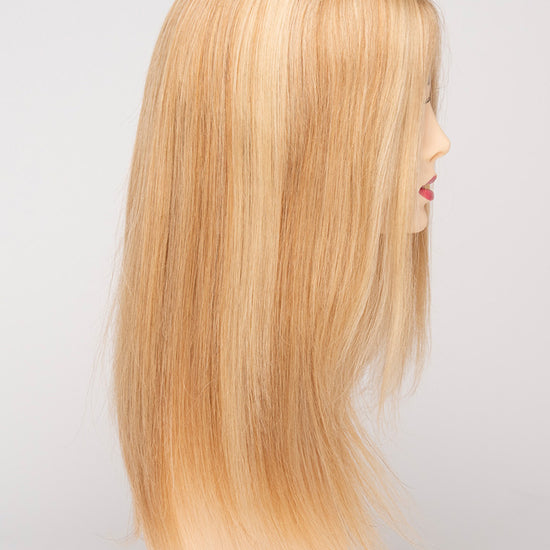 profile side of a long Kinner Beauty Wigs wig for woman on mannequin head 